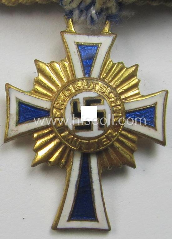 Miniature of an: 'Ehrenkreuz der deutschen Mutter - erste Stufe' (or: golden-class mothers'-cross) being a non-maker-marked example that comes in an overall nice- (albeit moderately worn- ie. used-), condition