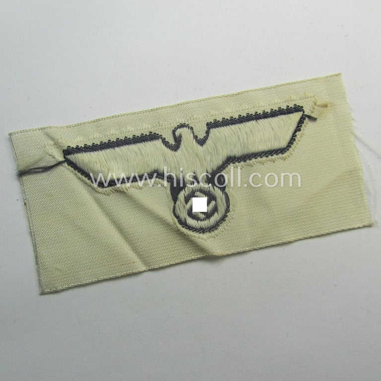 WH (KM) EM- (ie. NCO-) type side-cap-eagle (ie. 'Schiffchenadler für Mannschaften u. Uffz. der KM') in the 'BeVo'-weave-pattern on a white-coloured background as was specifically intended for usage on the various white-coloured side-caps