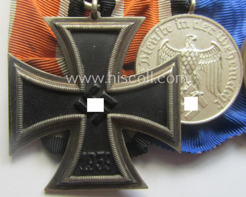 Three-pieced, WWII-period medal-bar (ie. 'Ordenspange') that resp. shows an: 'EK II. Kl.' (by the desirable 'Juncker'-company!), a: WH (Heeres o. KM) 'DA 4. St.' and a Czech 'Anschluss'-medal: '1. Oktober 1938'