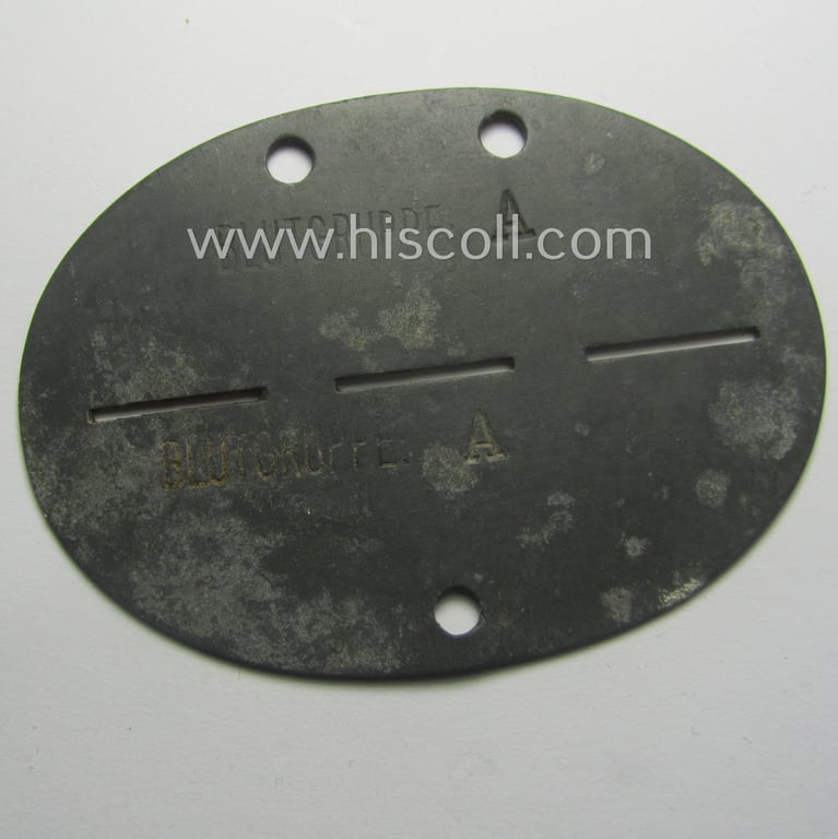 Zinc-based, WH (Heeres) 'Gebirgsjäger-Nachrichten'-related ID-disc bearing the clearly stamped unit-designation that reads: '1./Geb.Nach.Ers.Abt. 18' and that comes as issued and/or worn