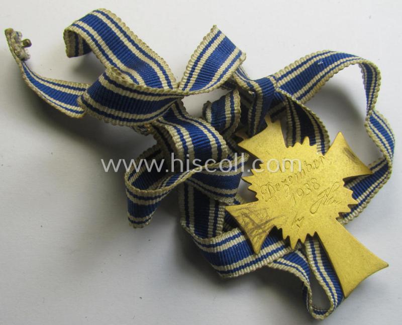 Attractive, 'Ehrenkreuz der deutschen Mutter - erste Stufe' (or: golden-class mothers'-cross) being a hardly used example that comes mounted onto its accompanying, long-sized ribbon as issued and/or recently found