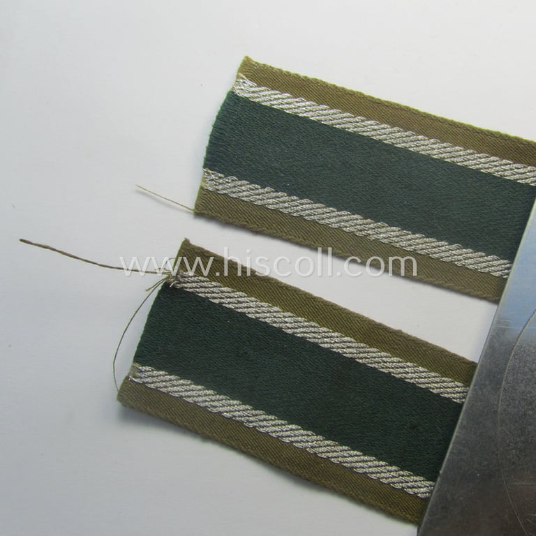 'BeVo'-like cuff-title (ie. 'Ärmelstreifen') entitled: 'Afrikakorps' being a presumably issued but simply never worn example that comes in an overall very nice- (ie. non-shortened- and never tunic-attached-), condition