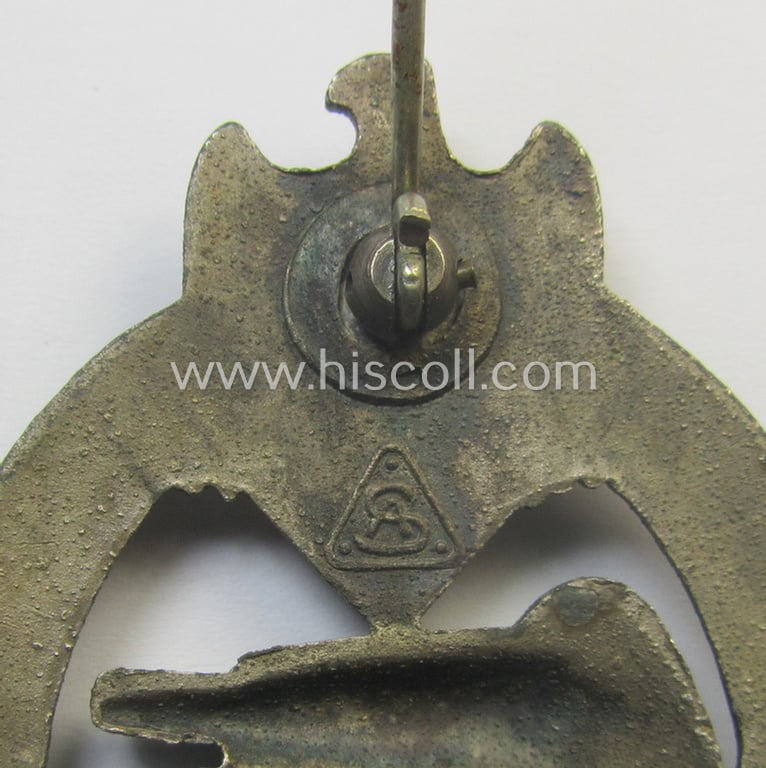'Panzerkampfabzeichen in Silber' (or: silver-class panzer-assault badge or PAB) being a clearly maker- (ie. 'AS' in a triangle-) marked- and/or typical zinc- (ie. 'Feinzink'-) based specimen as was procuced by a to date unknown maker