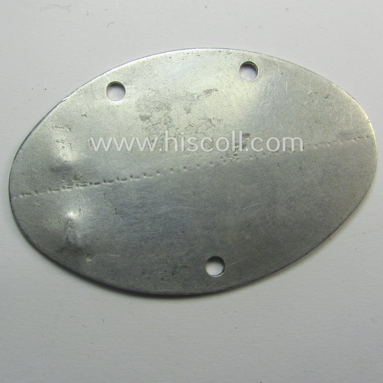 Early-war- (albeit 'standard-issue'-) pattern, WH (Kriegsmarine) typical aluminium- based- and silver-toned ID-disc (ie. 'Erkennungsmarke') bearing the engraved numeral (ie. date) that reads: 'Otto Schmidt - N 12748/40 E'