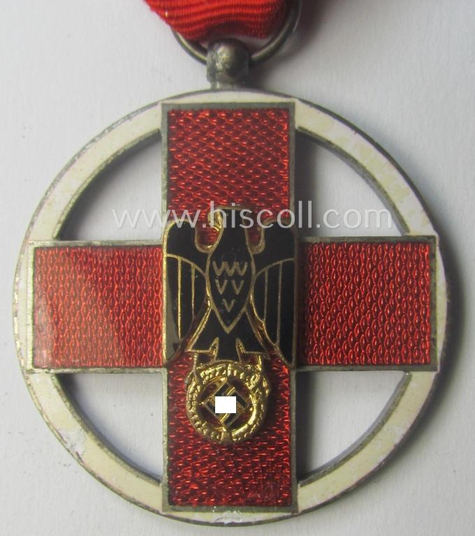 'DRK-Ehrenzeichen des 3. Modell' that comes together with its original (regular-sized- and period-mounted) ribbon (ie. 'Bandabschnitt') as issued and/or stored for decades