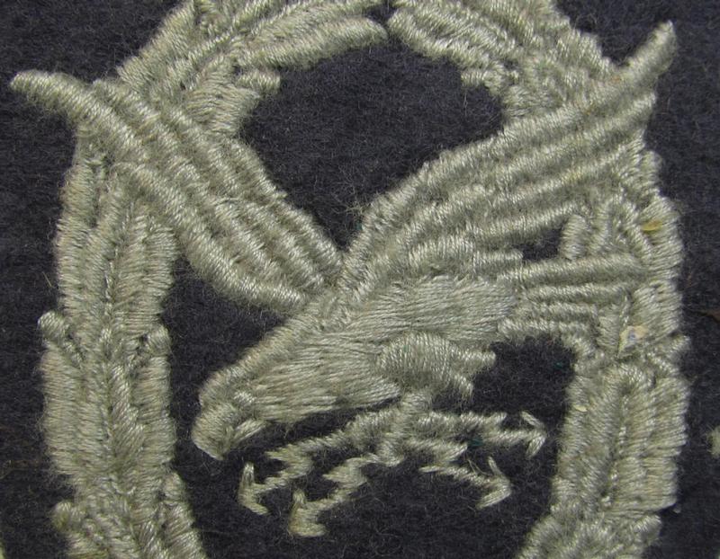 Attractive example of a WH (Luftwaffe) so-called: 'Fliegerschützen-Abzeichen mit Blitzbündel in Stoff' (or: cloth air-gunners-badge with lightning-bolts) being a nicely executed and typical machine-embroidered specimen