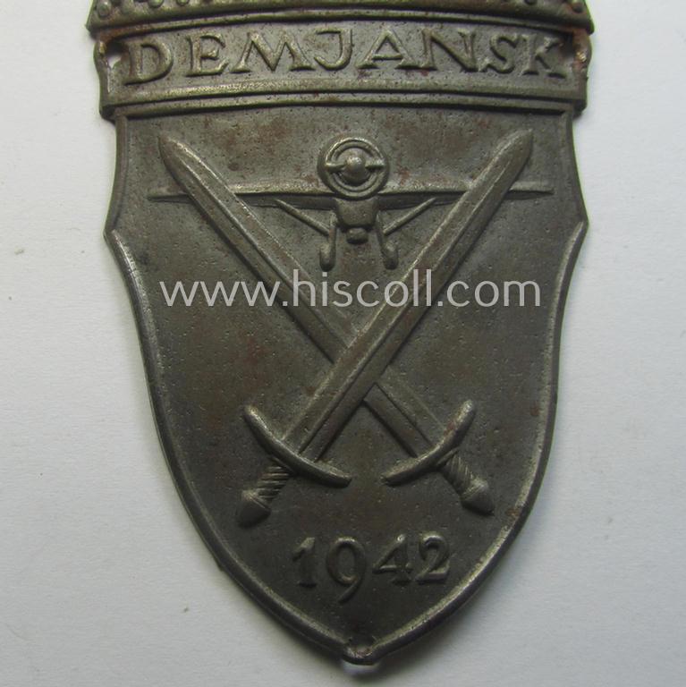 Nicely preserved - albeit regrettably incomplete ie. relic! - example of a WH (Heeres ie. Waffen-SS) 'Demjansk'-campaign-shield as executed in typical magnetic, so-called: 'Eisenblech'