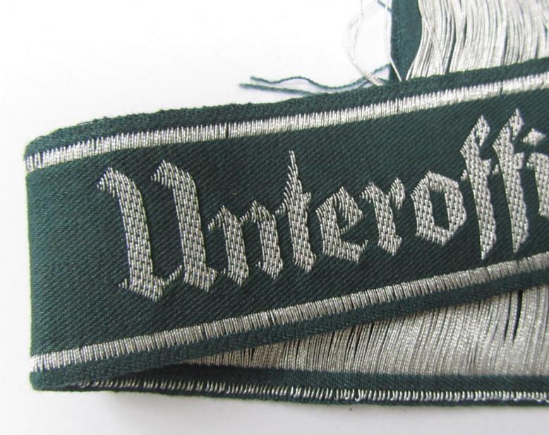 Attractive example of an - actually scarcely encountered! - WH (Heeres) linnen-based-, cuff-title (ie. 'Ärmelstreifen') entitled: 'Unteroffiziervorschule', as was executed in so-called: 'flat-wire'-style (ie. 'BeVo-weave'-pattern)