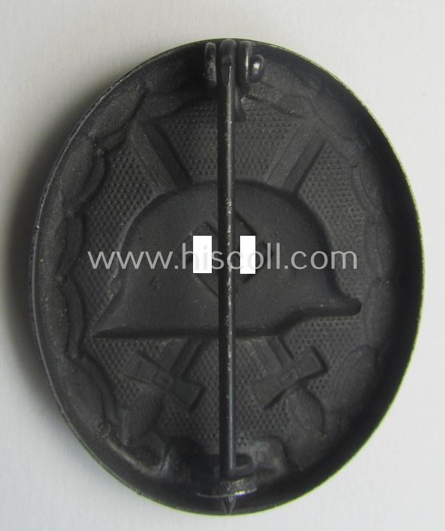 Black-class wound-badge (or: 'Verwundeten-Abzeichen in Schwarz') being a maker- (ie. '4'-) marked specimen as was produced by the maker (ie. 'Hersteller') named: 'Steinhauer & Lück'