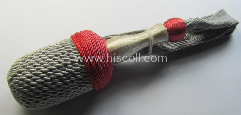 Attractive, red-, white- and red-coloured EM- (ie. NCO-) type side-arm knot (ie. 'Portepee' ie.: 'Troddel') as was used for the various WH-bayonets and that comes in an overall very nice- (ie. 'virtually mint- ie. unissued'-), condition