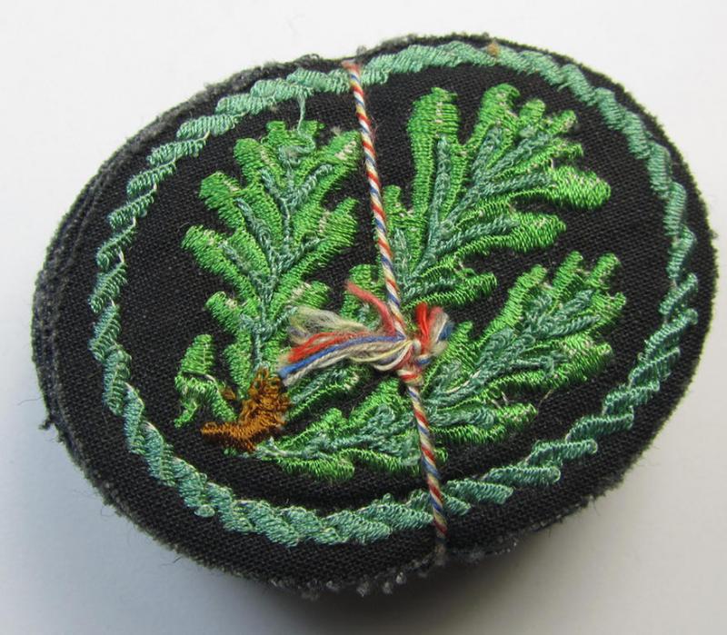 Attractive example of a WH (Heeres) so-called: 'Jäger'-armbadge, being a neatly machine-embroidered- and/or multi-coloured version as was executed on darker-green-coloured wool