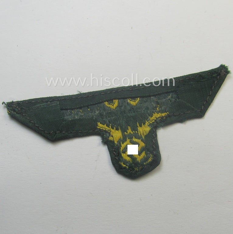 Moderately used- and/or carefully cap-removed, WH (Kriegsmarine o. Küsten-Artillerie) 'BeVo'-weave pattern side-cap-eagle onto a darker-green-coloured background