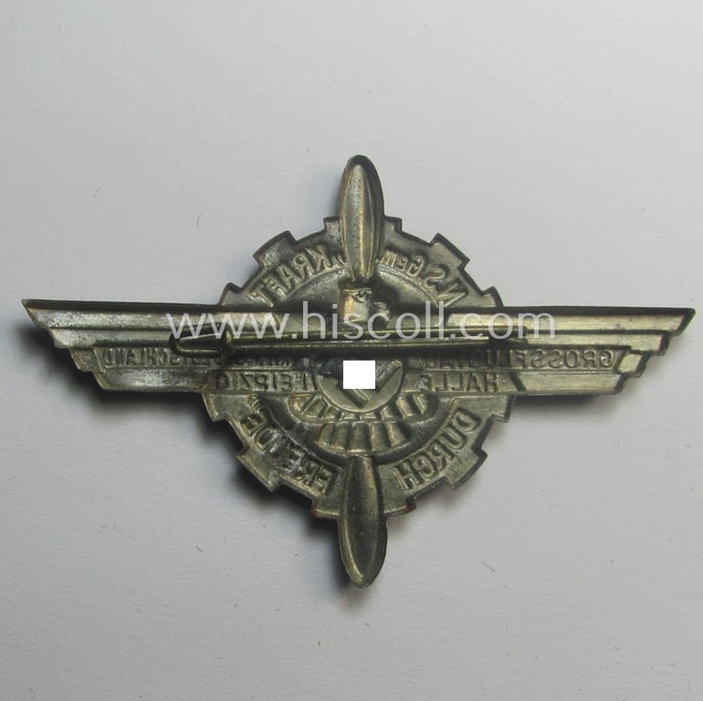 Attractive, 'KdF'- ('DAF- o. Kraft durch Freude'-) related day-badge (ie. 'tinnie') depicting a pair of wings, propellor and swastika coupled with the text: ' N.S. Gemeinschaft Kraft durch Freude - Grossflugtag Mitteldeutschland - Halle - Leipzig'