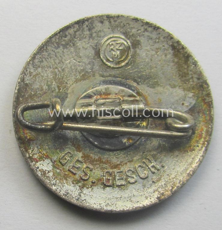 Early-pattern 'N.S.D.A.P. - Parteiabzeichen' showing a: 'Ges.Gesch.'-patent-pending-designation