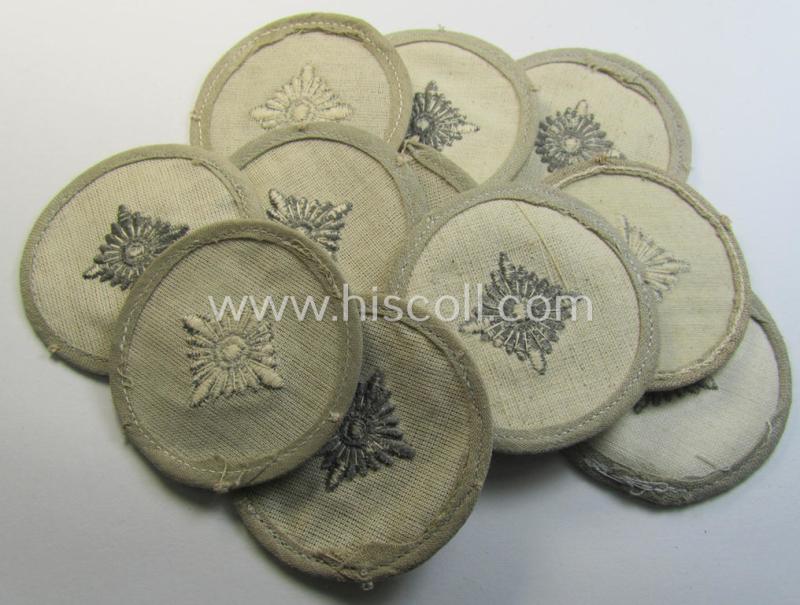 Attractive, WH (Heeres) rank-insignia (ie. arm-roundel) as was specifically intended for usage by an: 'Oberschütze' (being an interesting example as executed in silverish-grey-coloured linnen onto a 'HBT'-type, beige-coloured background)