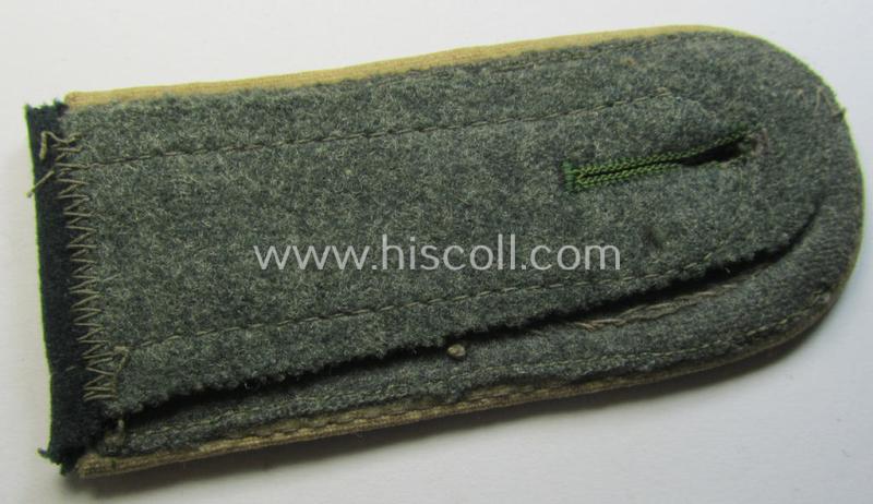 Single, early-war-period so-called: 'M36 o. M40'-pattern WH (Heeres) NCO-type shoulderstrap as piped in the white-coloured branchcolour as was intended for usage by an: 'Unteroffizier der Infanterie-Truppen'