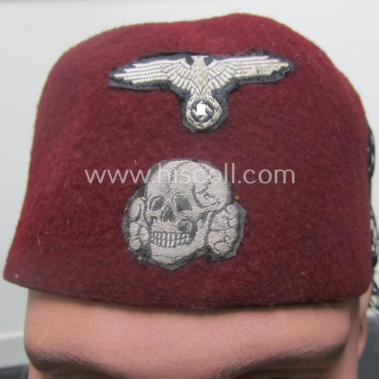 Maroon-red-coloured, Waffen-SS-pattern so-called: 'Fez' having a neat - and fully matching! - silver-grey-coloured- and/or 'BeVo'-woven insignia-set originally- (ie. 'off-factory'-) attached