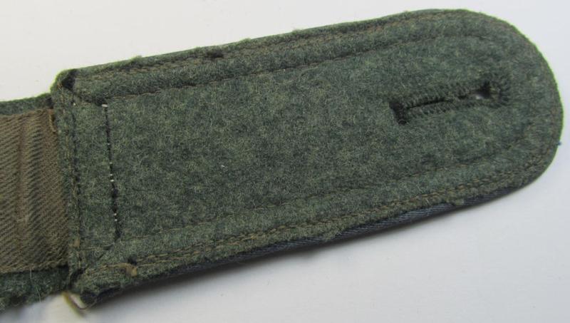 Single, mid-war-period, so-called: 'M43'-pattern, WH (Heeres) NCO-type shoulderstrap as piped in the light-blue-coloured branchcolour as was intended for usage by an: 'Uffz. der Nachschub-Truppen'