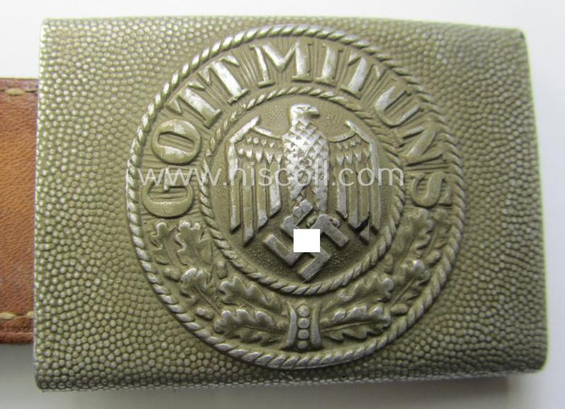 WH (Heeres) 'standard-pattern', field-grey-toned- and aluminium-based belt-buckle being a maker- (ie. 'H. Arld - Nuernberg'-) marked- and/or: '1937'-dated example that comes mounted onto its leather-based tab