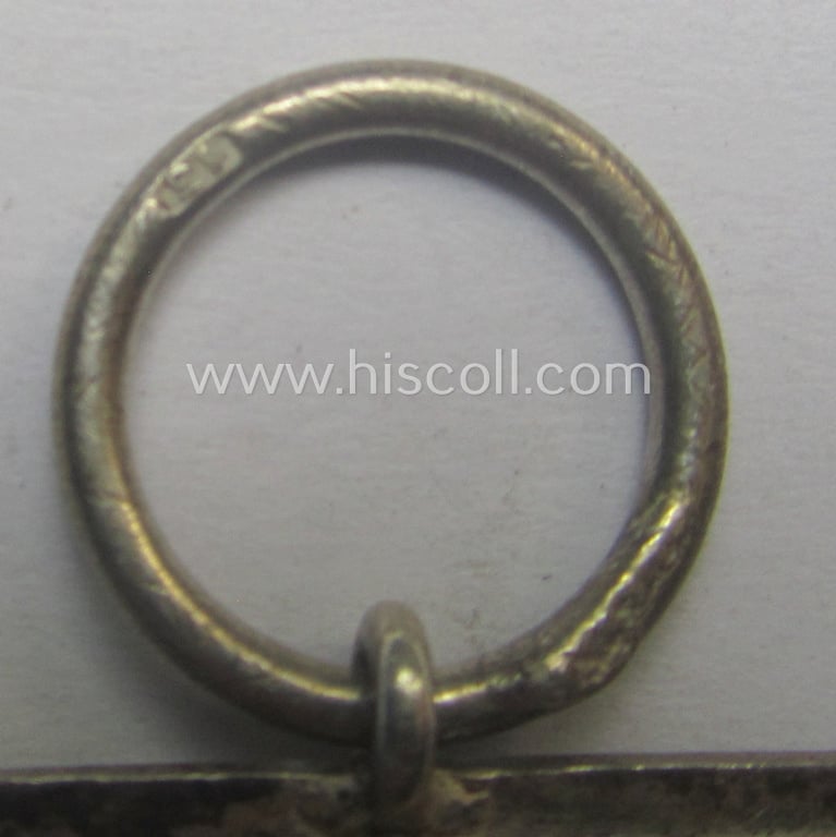 'EK II. Klasse' being a maker- (ie. '13'-) marked example that comes together with its original- and never-mounted ribbon (ie. 'Bandabschnitt') as was produced by the maker (ie. 'Hersteller'): 'Gustav Brehmer'