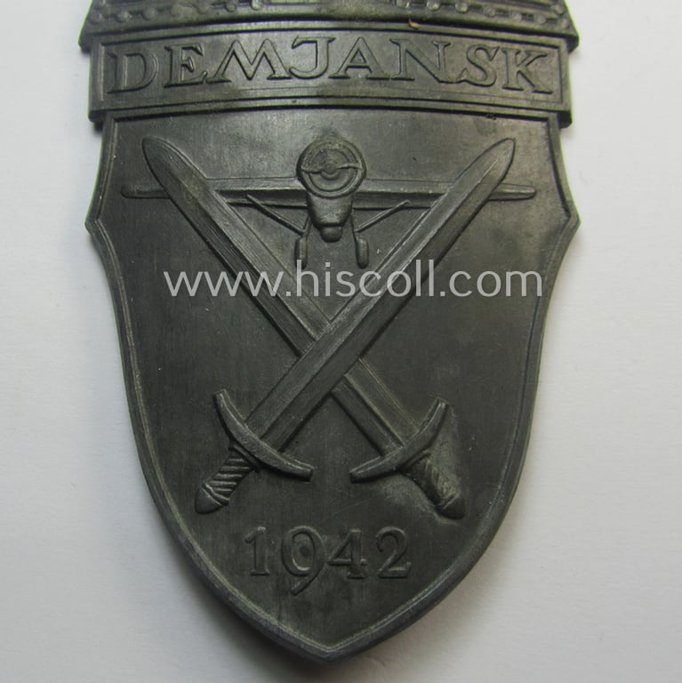 'Virtually mint' - albeit regrettably incomplete - example of a WH (Heeres ie. Waffen-SS) 'Demjansk'-campaign-shield as executed in typical non-magnetic, zinc (ie. 'Feinzink')