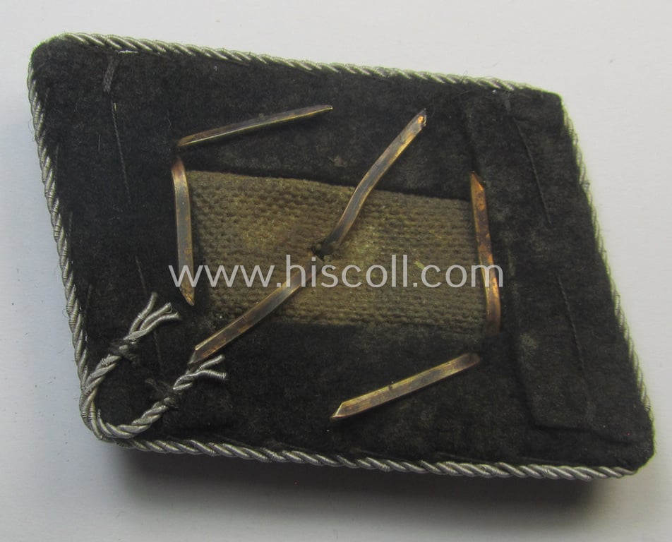 Waffen-SS (ie. 'SS') officers'-pattern collar-rank-tab ('Kragenspiegel für Führer') being a 'standard-issue'- (ie. 'RzM'-) pattern example as executed in the black-coloured wool as was intended for an: 'SS-Untersturmführer'