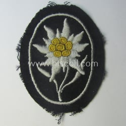 Waffen-SS-pattern, black-coloured sleeve-insignia (ie. 'Ärmelabzeichen') depicting an: 'Edelweiss'-flower...