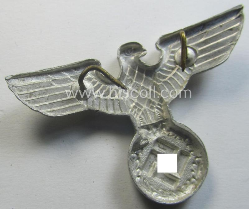 Smaller-sized, bright silverish-grey-coloured- and typical aluminium-based (political-style) visor- (ie. 'Schirmmützen'-) cap-eagle being a detailed example that is neatly: 'RzM - M1/17'-marked on its back