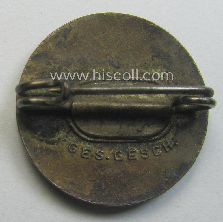 Early-pattern 'N.S.D.A.P. - Parteiabzeichen' showing a: 'Ges.Gesch.'-patent-pending-designation