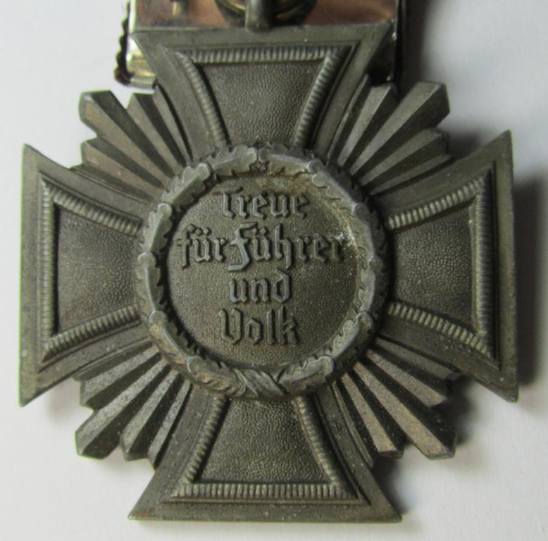 Attractive - and not that easily found! - 'N.S.D.A.P. Dienstauszeichnung in Bronze' (ie. '3. Stufe für 10 Jahre t.D.') being a 'thinner-shaped'-pattern, zinc- (ie. 'Feinzink'-) based example that comes mounted onto a so-called: 'Einzelspange...