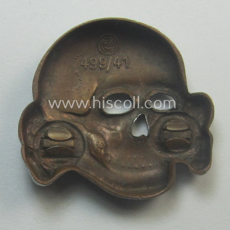 Superb - albeit regrettably incomplete but nevertheless rarely encountered! - 'Waffen-SS' visor-cap skull (ie. 'Totenkopf für Schirmmütze') being a detailed- and/or maker- (ie. 'RzM 499/41'-) marked example