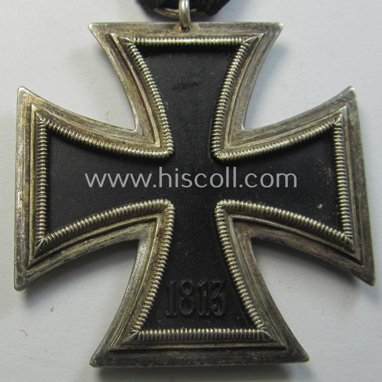 Neat, Iron Cross 2nd class (or: 'EK II. Klasse') being a non-maker-marked example that comes mounted onto its original (Austrian-styled!) ribbon (ie. 'Bandabschnitt') as was (I deem) produced by the (Austrian-based) company named: 'Rudolf Souval...