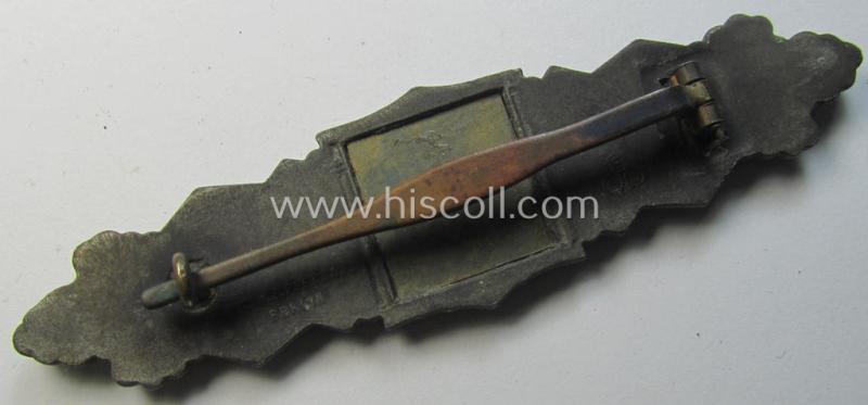 'Nahkampfspange in Bronze' (or: bronze-class close-combat clasp ie. CCC) being a maker- (ie. 'FLL'-) marked- and/or non-converse-shaped so-called: '3rd pattern'-specimen as was produced by the maker- (ie. 'Hersteller') 'Friedrich Linden'