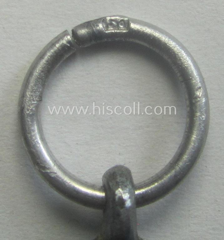 'Luftschutz-Ehrenzeichen 2. Stufe' being a maker- (ie. '10'-) marked example, as executed in zinc-based metal (ie. 'Feinzink') and that comes stored in its (scarcely seen!) 'Zellstoff'-based pouch by the maker: 'Katz u. Deyhle'