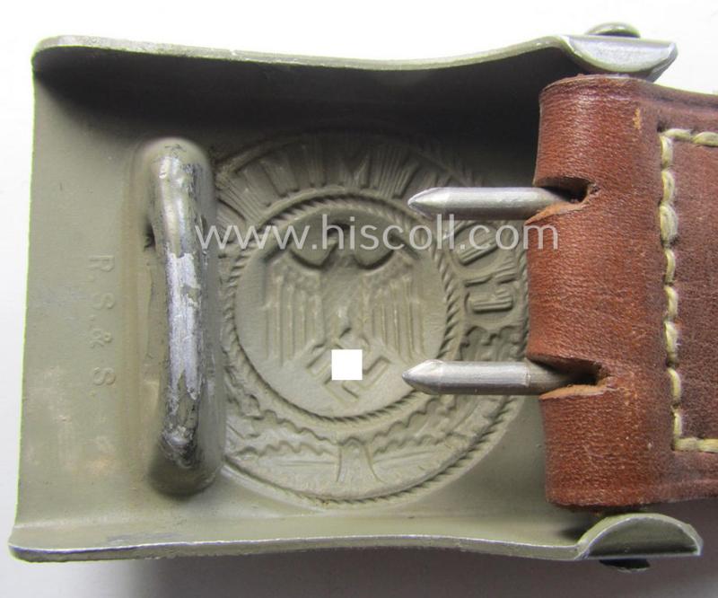WH (Heeres) 'standard-pattern', field-grey-toned- and aluminium-based belt-buckle being a maker- (ie. 'R. Sieper & Söhne'-) marked- and/or: '1938'-dated example that comes mounted onto its leather-based tab