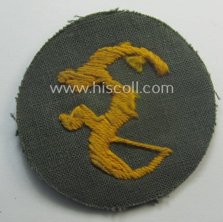 WH (Heeres) so-called: trade- and/or special-career arm-insignia (ie. 'Laufbahn- o. Tätigkeitsabzeichen') as was specifically intended for an army: 'Feuerwerker' (ie. artician)