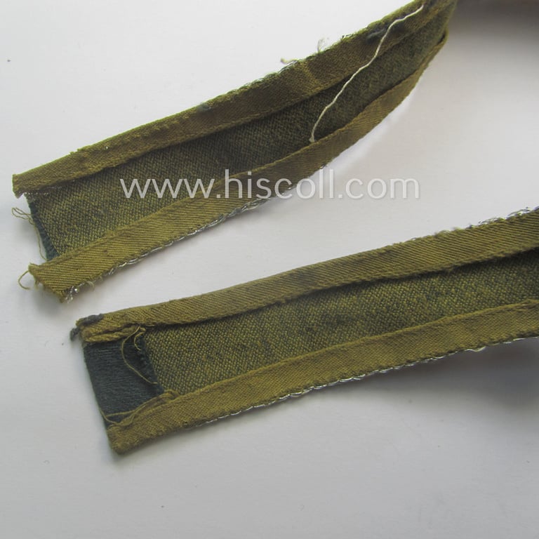 Truly worn, 'BeVo'-like cuff-title (ie. 'Ärmelstreifen') entitled: 'Afrikakorps' being a with certainty issued example that comes in an overall very nice- (ie. non-shortened- and/or once tunic-attached-), condition
