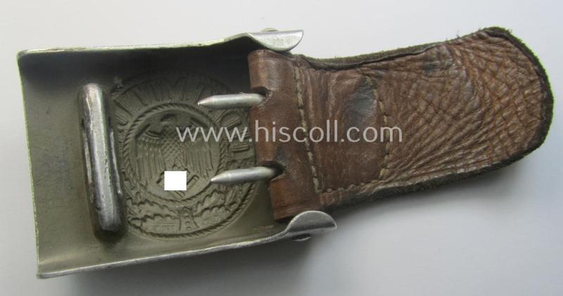 WH (Heeres) 'standard-pattern', field-grey-toned- and aluminium-based belt-buckle being a maker- (ie. 'H. Arld - Nuernberg'-) marked- and/or: '1937'-dated example that comes mounted onto its leather-based tab