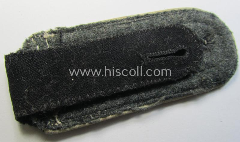 Superb - albeit regrettably single! - Waffen-SS NCO-type shoulderstrap as piped in the white-coloured branchcolour as was intended for usage by an: 'SS-Unterscharführer' who served within the: 'Waffen-SS Infanterie-Truppen'