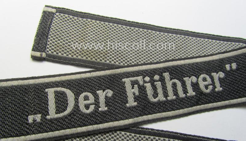 Waffen-SS, 1943-pattern cuff-title (ie. 'Ärmelstreifen') depicting the machine-woven Latin script text in silver-grey linnen as was specifically intended for usage by a member of the: 'SS-Regiment “Der Führer”