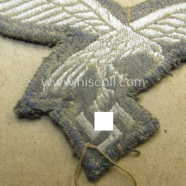 Interesting, WH (Luftwaffe) officers'- (ie. evt. NCO-) type breasteagle (ie. 'Brustadler') as was executed in neatly machine-woven silver-coloured thread (ie. 'flatwire-style') and that comes as GI-sent-back 'Christmas-souvenir'