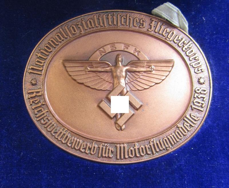 Superb, 'NSFK'-related commemorative-plaque (ie. 'Erinnerungs- o. nichttragbare Plakette') entitled: 'Reichswettbewerb für Motorflugmodelle 1938' that comes with its accompanying award-document and dito etui