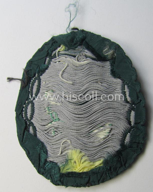 Truly used and/or tunic-removed, WH (Heeres) EM- (ie. NCO-) type, so-called: 'Edelweiss'-armpatch being a 'BeVo'-woven example as was executed on darker-green linnen as was specifically intended for usage by the: 'Gebirgsjäger-Truppen'