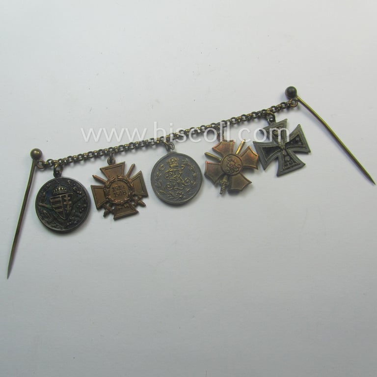 Three-pieced, (pre) 'WWI'-related medal-bar grouping (ie. 'Ordenspange-Satz') resp. depicting a WWI-period: 'EKII. Kl.', a: Sachs. 'Ehrenkreuz mit Schw.', a: 'Friedrich August Medaille in Silb.', a: 'FKK 1914-18' and an Austrian WWI-comm. medal