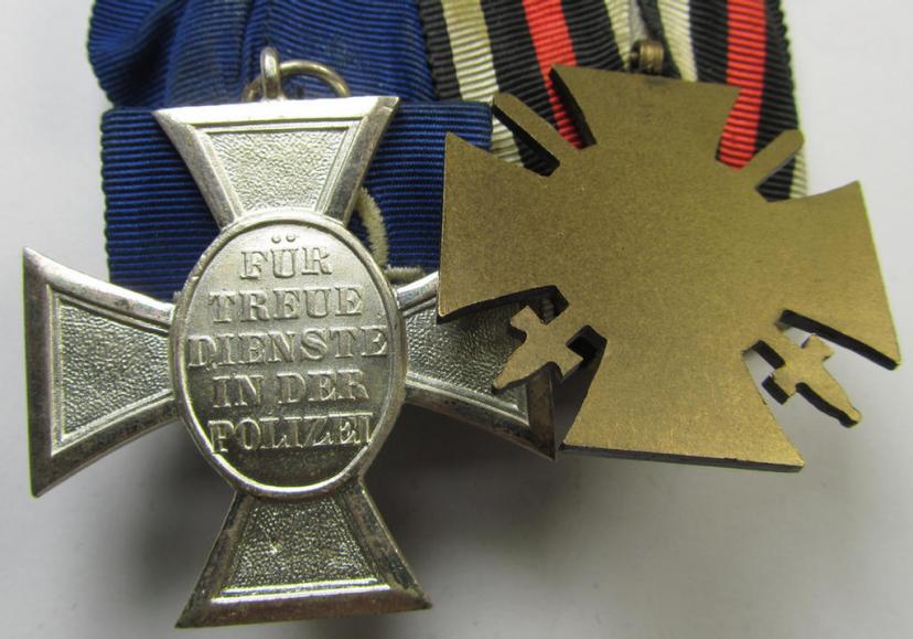 Two-pieced medal-bar (ie. 'Doppelspange') respectively depicting a WWI-period: 'Frontkämpferkreuz 1914-18' (ie.: 'Kriegsteilnehmerkreuz mit Schwerter') and a detailed: 'Polizei-Dienstauszeichnung 2. Stufe'