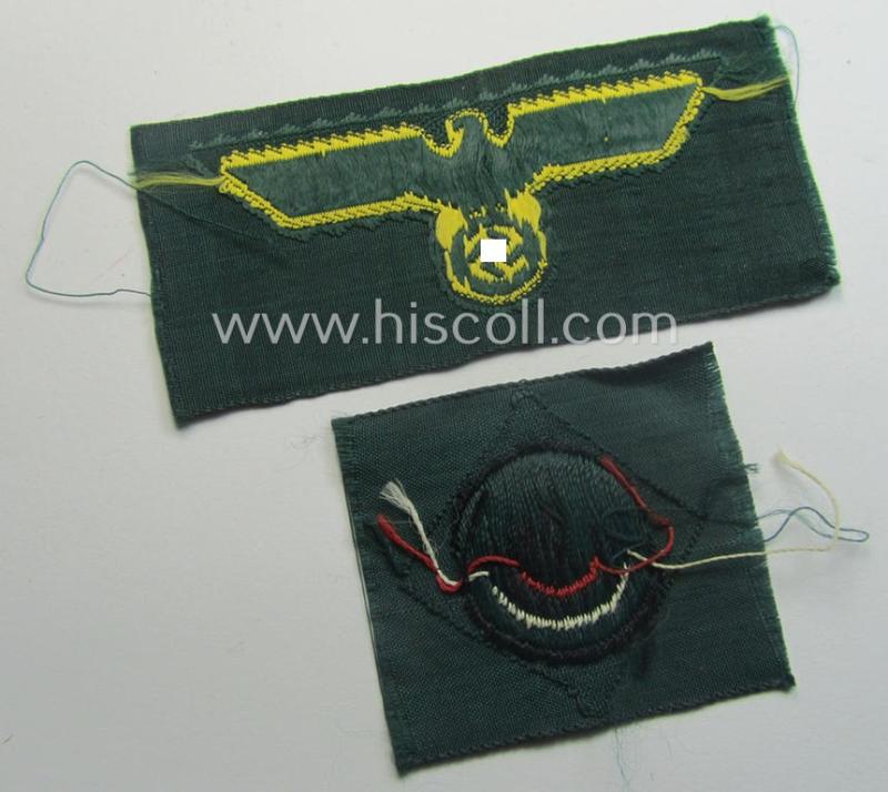 WH (KM ie. 'Küsten-Marine o. Marine-Art.') side-cap-eagle and cocarde-set (being a 'virtually mint- ie. unissued' set as executed in golden-yellow-coloured linnen on a darker-green-coloured background)