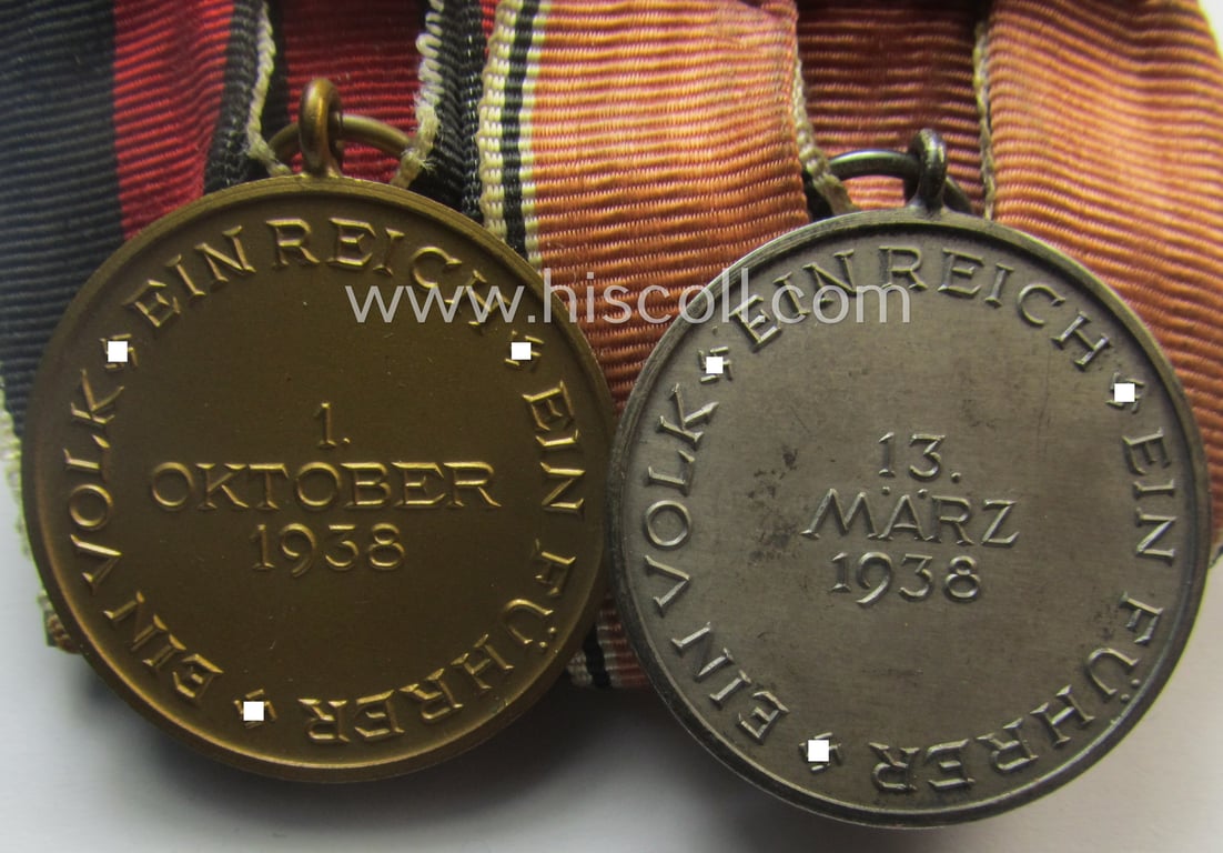 2-pieced, WH (Heeres o. Kriegsmarine) medal-bar (ie.: 'Doppelspange') showing resp. an Austrian and Czech 'Anschluss'-medal (which latter comes with a firmly attached 'Prager Burg-Spange')