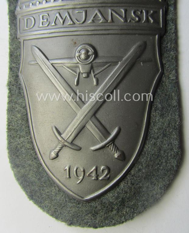 Superb, WH (Heeres ie. Waffen-SS) 'Demjansk'-campaign-shield as executed in typical magnetic, so-called: 'Eisenblech' (and being of the 'missing-log' variant-pattern)