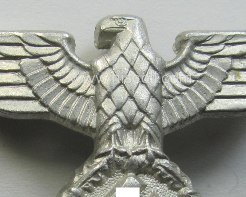 Smaller-sized, bright silverish-grey-coloured- and typical aluminium-based (political-style) visor- (ie. 'Schirmmützen'-) cap-eagle being a detailed example that is neatly: 'RzM - M1/17'-marked on its back