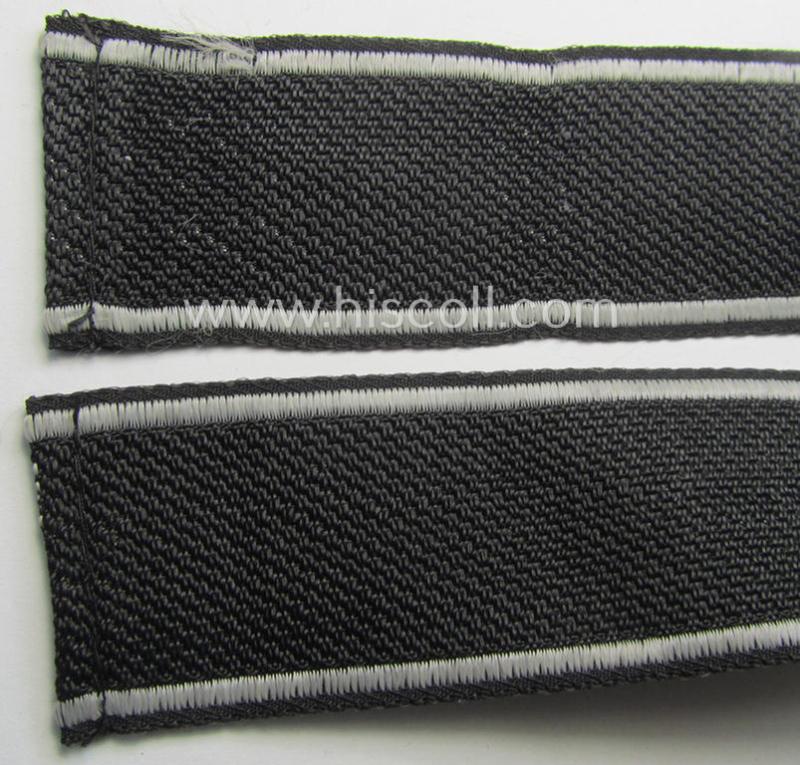 Waffen-SS, 1943-pattern cuff-title (ie. 'Ärmelstreifen') depicting the ('BeVo') machine-woven, Latin script text in silverish-grey linnen as was intended for a member of the: '8. SS-Kavallerie-Division “Florian Geyer”